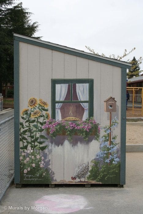 flowers on an outdoor shed mural