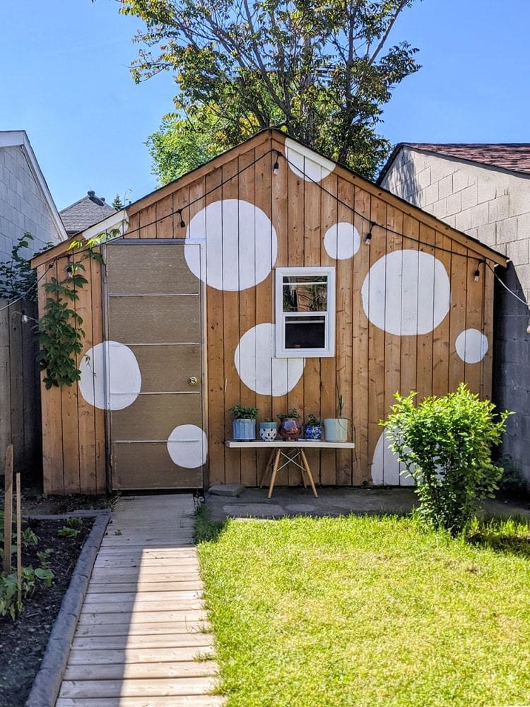 large white dots on the front of a shed outdoor shed mural