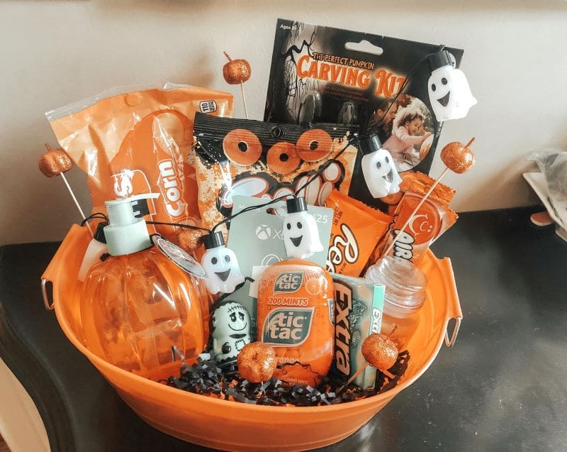 orange basket filled with halloween treats