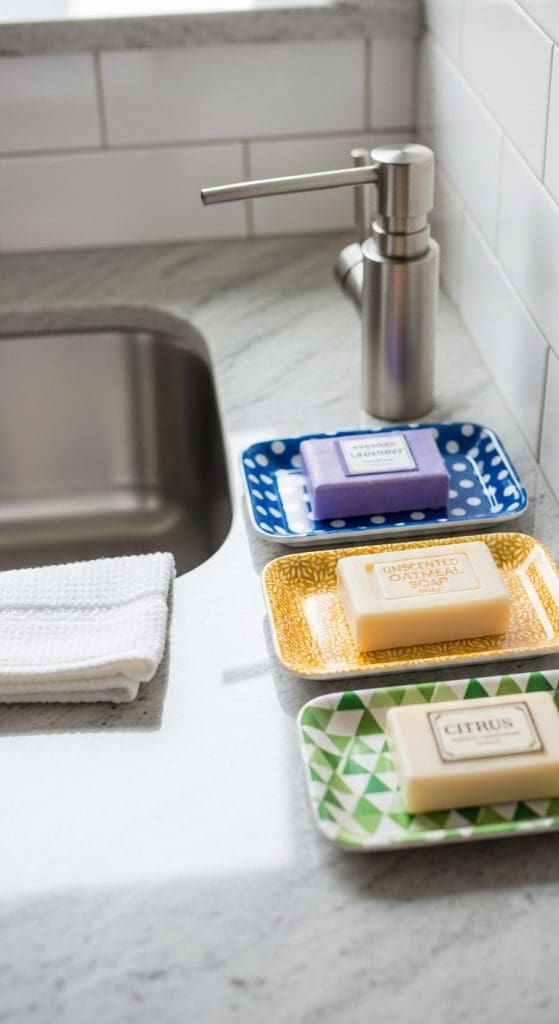 different color soap trays on kitchen counter with different soap bars