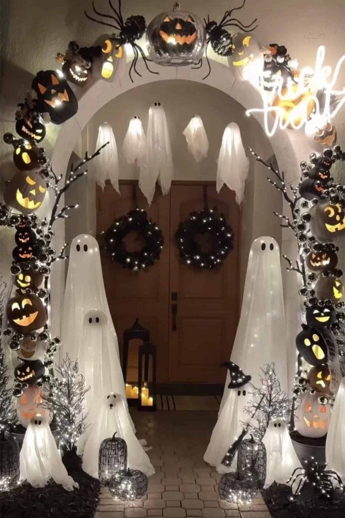 Floating ghosts on an archway at the front of the house