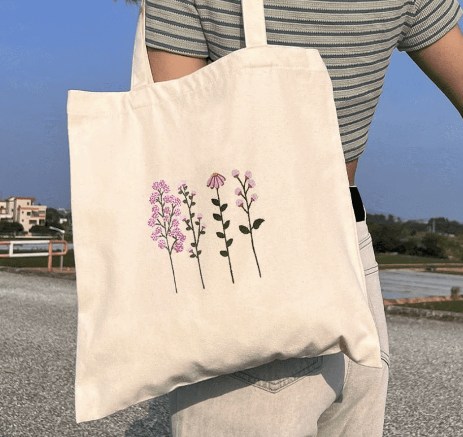 white tote bag with small purple flowers on
