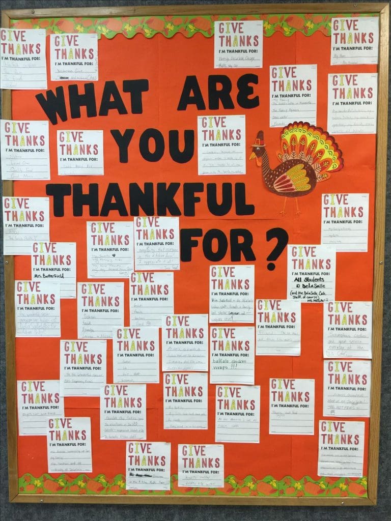 a notice board in a Thanksgiving theme with notes on what colleagues are thankful for