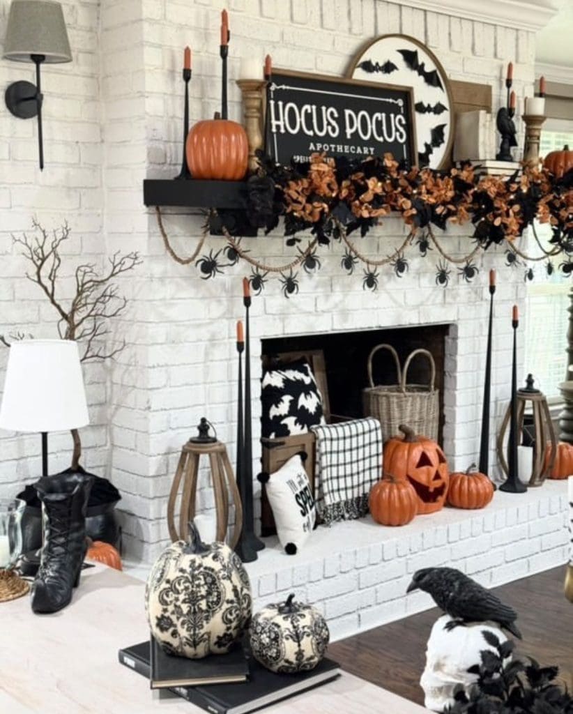 black and white sign on white fireplace that reads "HOCUS POCUS" decorated with Halloween decor