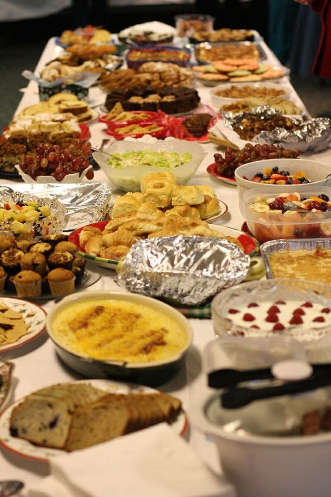 large table full of pot luck food