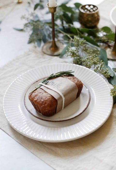 mini load of bread on a white plate on a Thanksgiving Place Setting