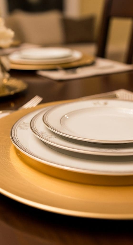 stacked plates on a larger gold plate