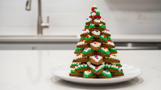 gingerbread christmas tree decorating with green icing