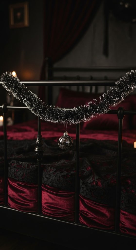 dark tinsel with a single ornament hanging from bed frame for christmas