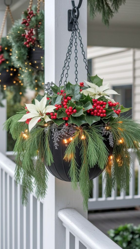 Hanging basket hanging from porch for Christmas with evergreen, red berries and lillies decorated with fairy lights