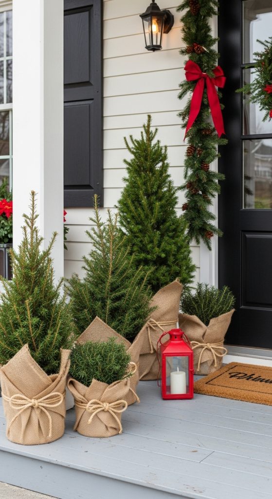 planters wrapped in burlap on the front porch as simple chrsitmas decor