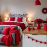 studio apartment decorated in red for christmas