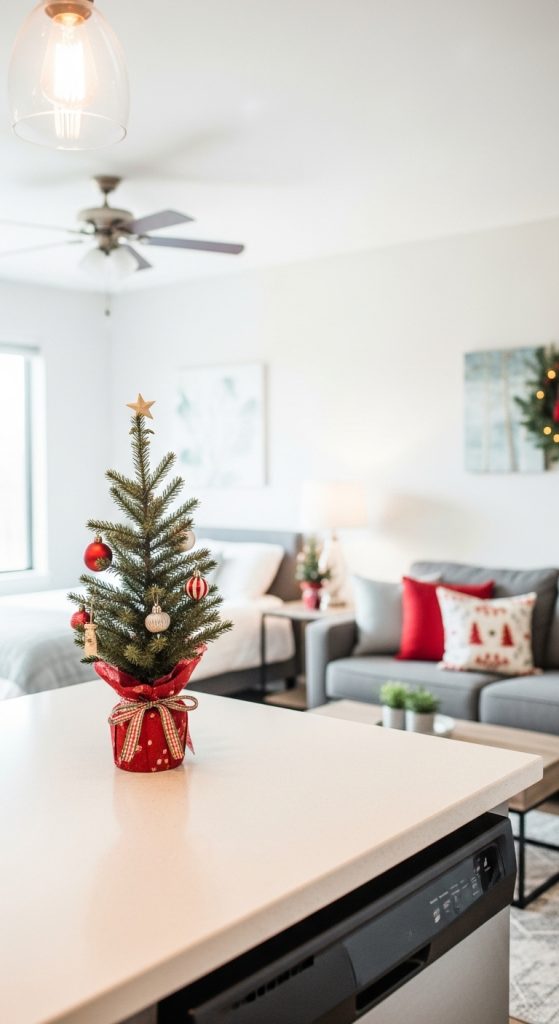 Mini Christmas tree on the kitchen counter decorated with ornaments