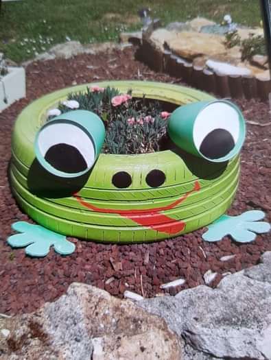 tire planter set to look like a frog