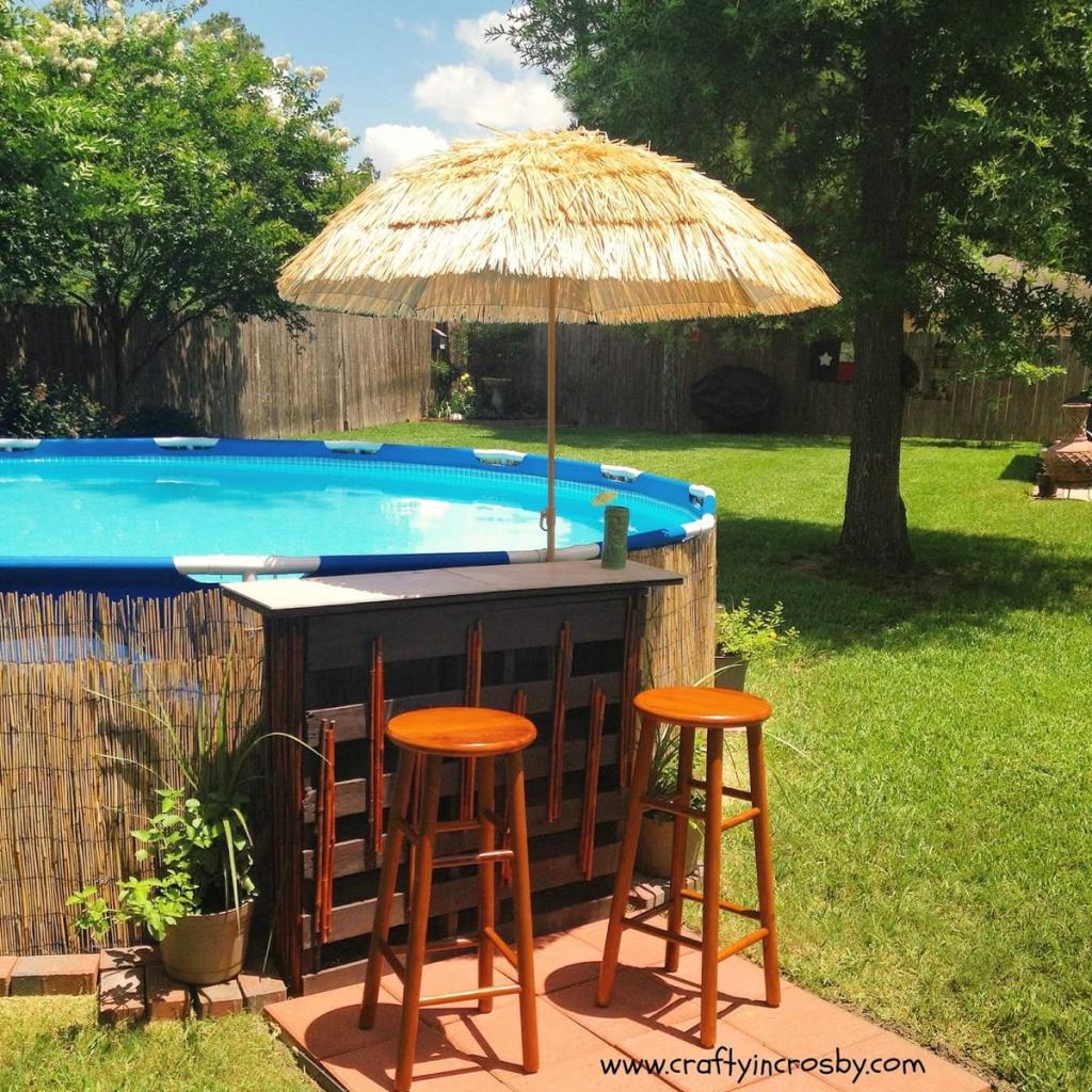 tiki style bar attached to an above ground pool