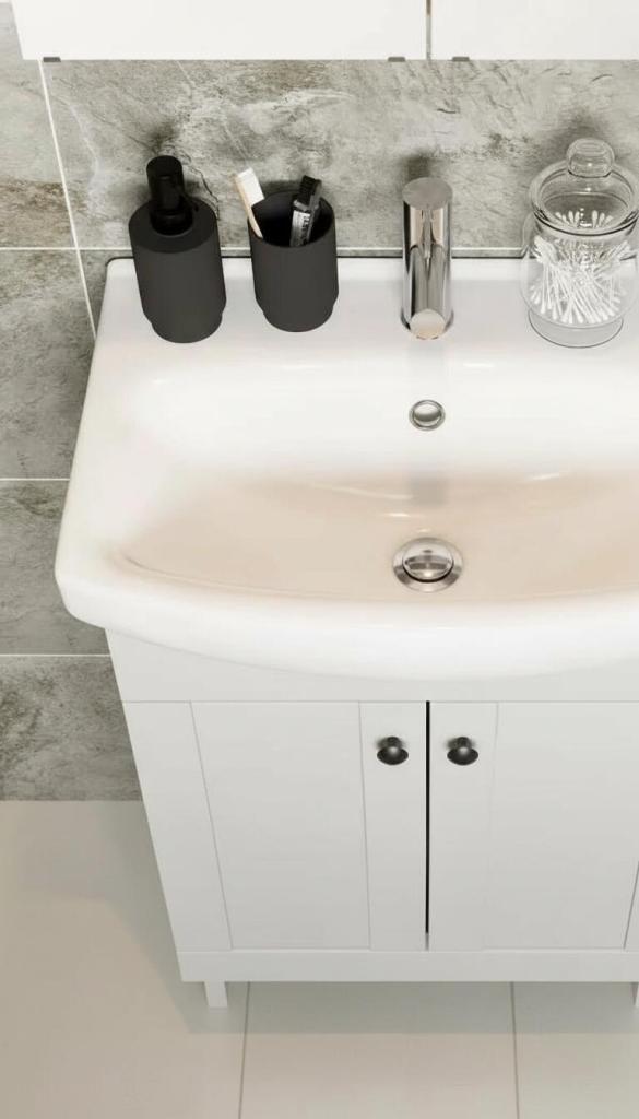 small glass vase with cotton buds