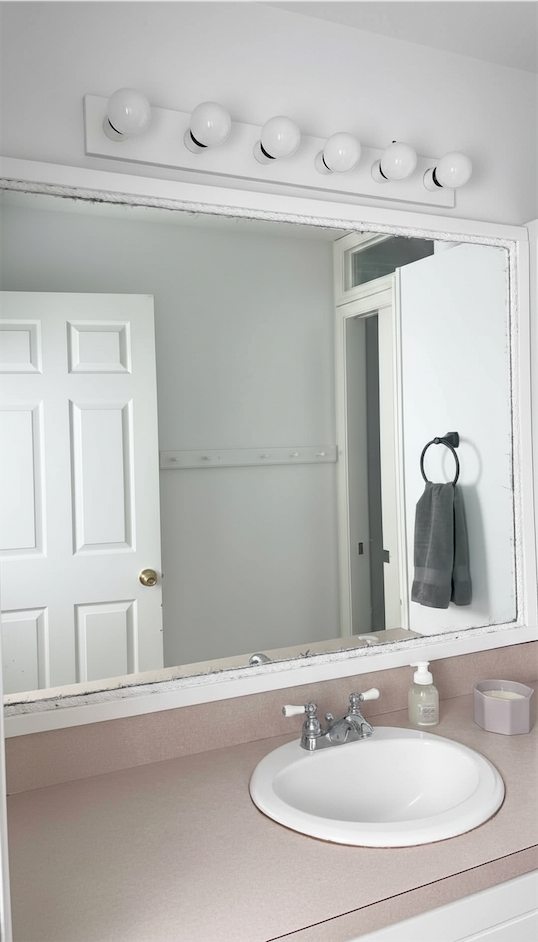 white frame around mirror Renter Friendly Bathroom Decor