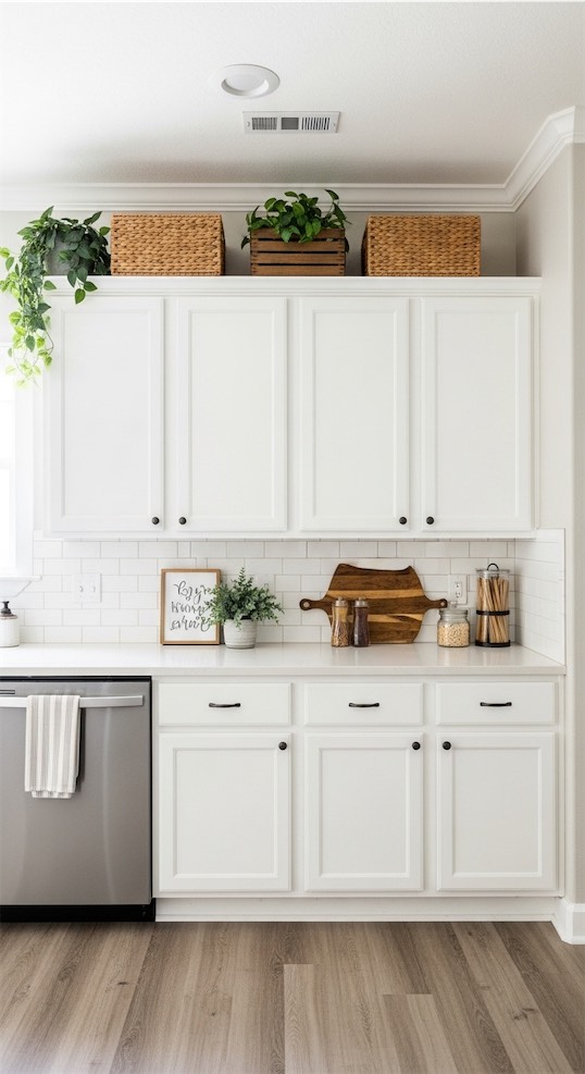 mixed baskets with greenery on top of kitchen cabinets