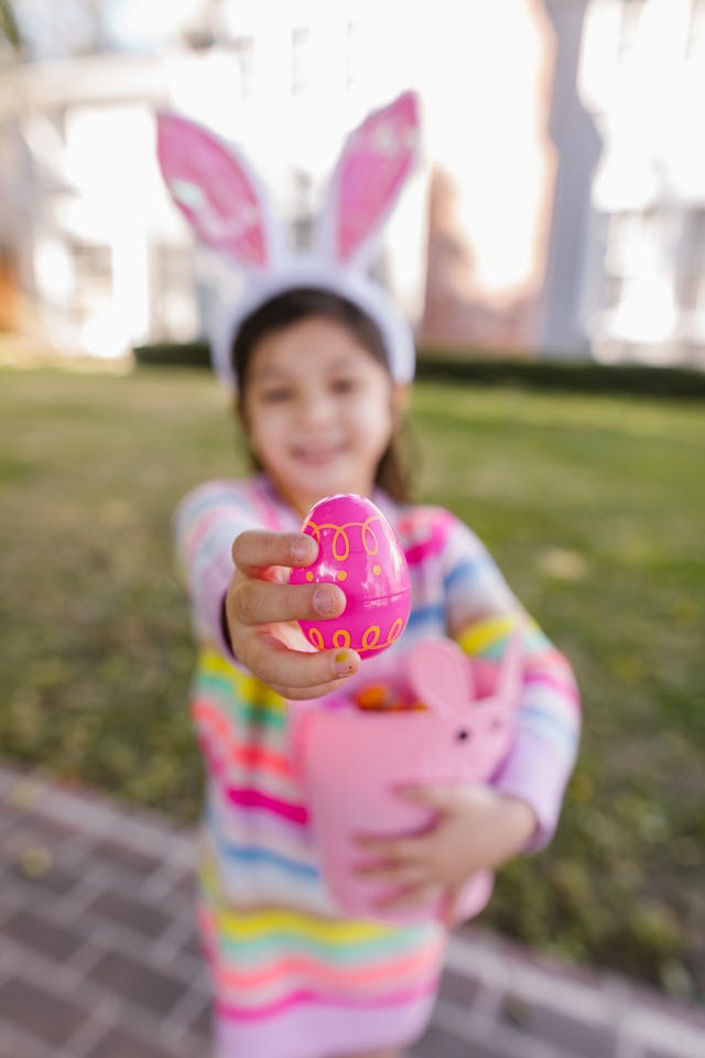 young girl doing an easter egg hunt