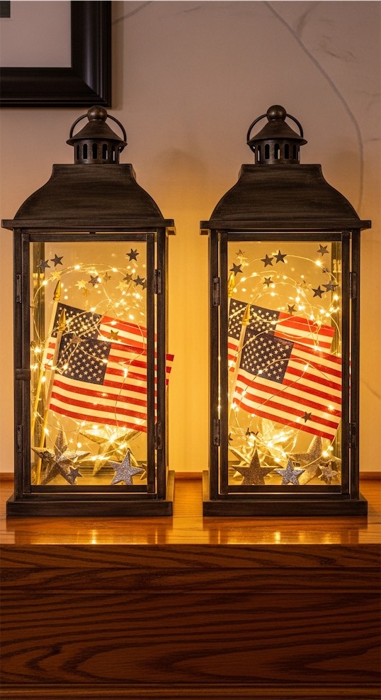 two lanterns filled wth mini american flags and fairy lights