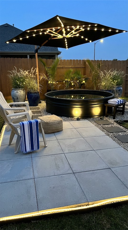 black stock tank pool near Paver Patio