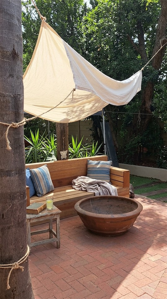 old bedsheet used as outdoor shade
