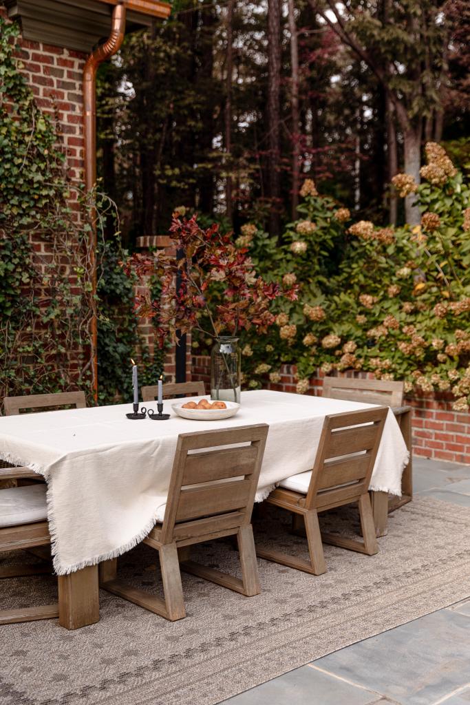 outdoor rug underneath outdoor dining area