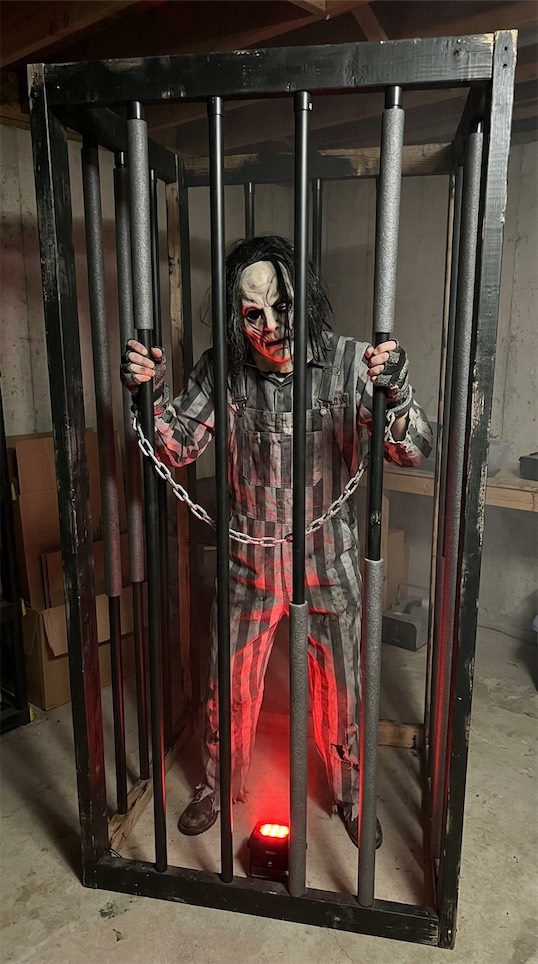 Prisoner in a cage halloween garage Halloween Party Decor Ideas 